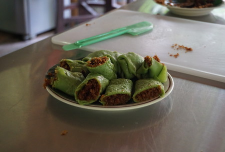 Kueh dadar - pandan pancakes filled with toasted coconut and palm sugar